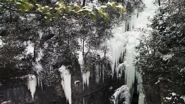 Icicles On The Sandstone Gorge Of The Grand Canyon of the Adirondacks In Ausable Chasm, NY USA. Tilt-down