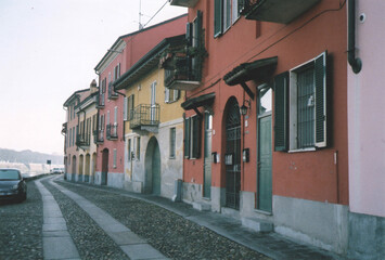Fototapeta na wymiar Colorful Houses of Borgo Ticino Ancient Village. Pavia, Italy. Film Photography
