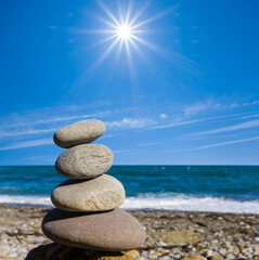 closeup heap of marine pebble on the sea coast at sunny day