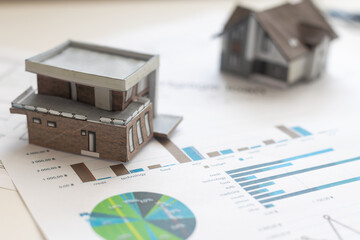 Volumetric project of house. Layout of a house with an open roof. Miniature layout of a cottage top view. Building model as a symbol of architectural business. Design in architectural bureau