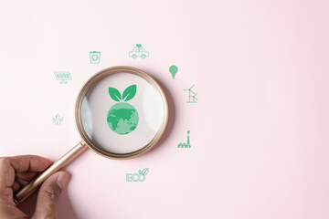 Magnifier focus to global earth decrease CO2 or carbon dioxide emission, carbon footprint and...