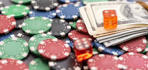 Poker chips and dollar bills on casino table. Gambling. poker as a game of professionals. responsibility for games.