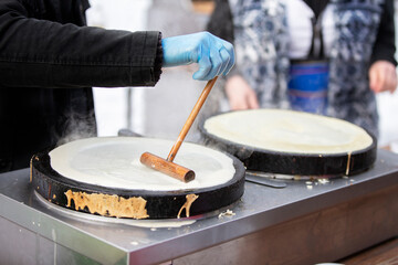 Pour the pancake batter into the skillet. Prepare pancakes.