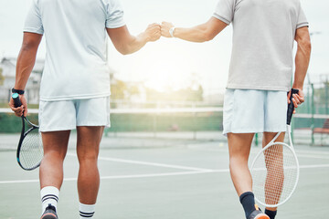 Man, hands and fist bump in tennis for teamwork, sports motivation or competitive game on the court. Hand of men touching fists in team player respect, support or sport training for fitness workout