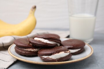 Tasty sweet choco pies on table, closeup