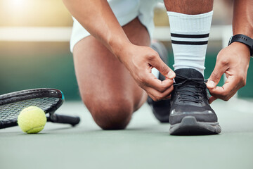 Man, hands and tying shoes on tennis court getting ready for sports match, game or competition. Hand of male person or sport player tie shoelaces in preparation for fitness, workout or exercise