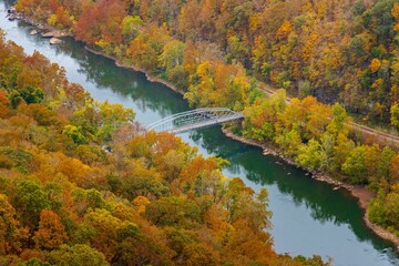 Aerial view of a colorful autumn landscape with a bridge in New River Gorge National Park