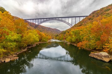 Fototapeta na wymiar Aerial view of a colorful autumn landscape with a bridge in New River Gorge National Park