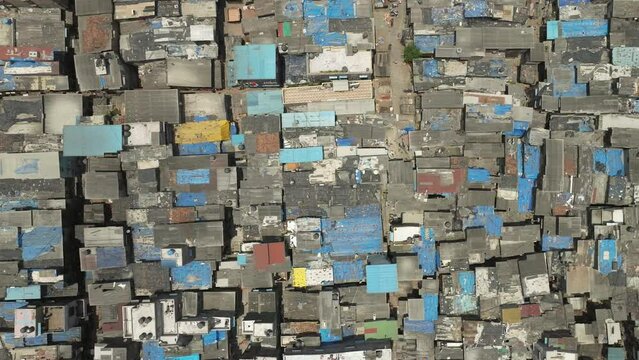 Flyover Dharavi slum, a densely populated slum in Mumbai, India. Drone flying right