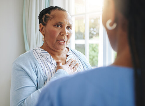 Senior Healthcare, Trust And A Black Woman With A Doctor For Medicine Communication And Medical Problem. Support, Consulting And An Elderly Patient Talking To A Nurse At A Nursing Home About Health