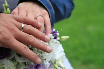 Fototapeta premium wedding rings on the human hands
