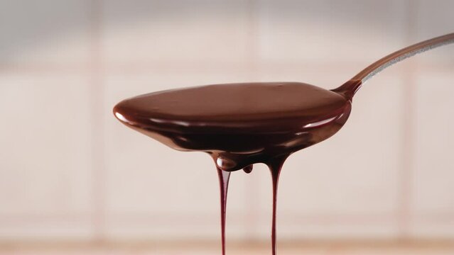 Slow-motion footage of a spoon with melted chocolate