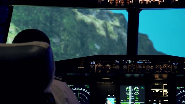 Close-up shot of pilots inside a flying aircraft