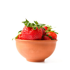 Large berries of organic strawberries in a clay ceramic bowl isolated on a white background.