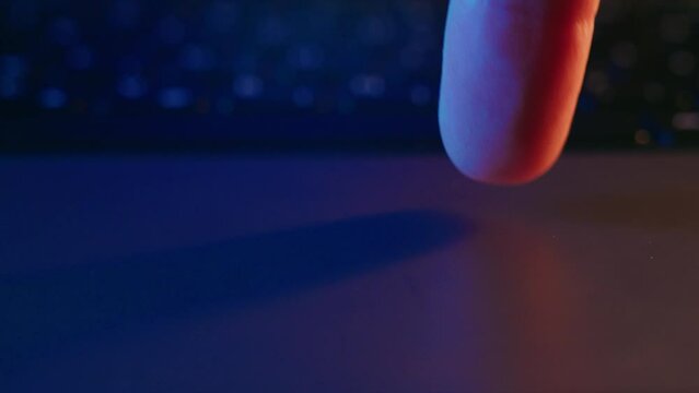 Close-up view of a finger moving on a trackpad