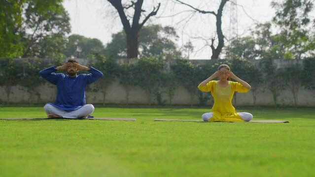 Bhramari Pranayam or yoga or breathing exercise done by Indian couple
