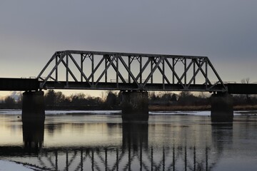Bridge over a frozen lake in winter