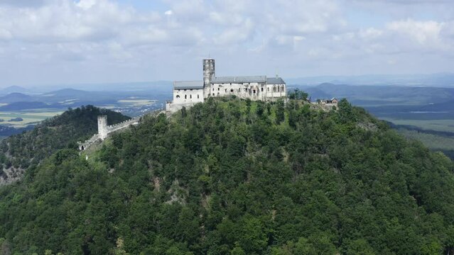 Drone shot of the Bezdez Castle, a Gothic style castle on a hilltop, Czech Republic