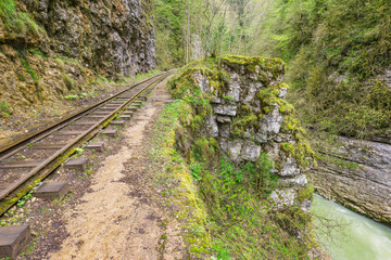 Narrow railway in the deep gorge. Caucasus.