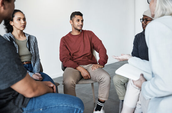 Psychology, Psychologist And Group Of People At A Therapy Session For Mental Health Or Depression. Community, Diversity And Patients Or Friends In A Circle Talking To A Therapist At Counseling Center