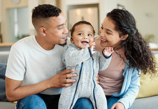 Smile, family and baby in home living room, bonding and having fun in house. Father, mother and newborn on sofa, happy and relax with child, care and enjoying quality time together with happiness. - Powered by Adobe