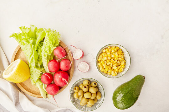 Plant based,vegan, Mediterranean, FODMAP diet food. Organic fruits, vegetables, greenery, olves with copy space.