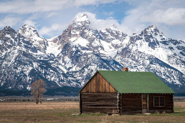 Fototapeta na wymiar Cabin in front of Grand Tetons