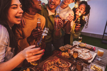 group multiracial friends at night terrace party with alcohol, happy group of young friends...