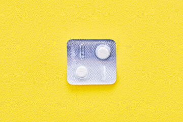Antiparasitic drugs on yellow background.