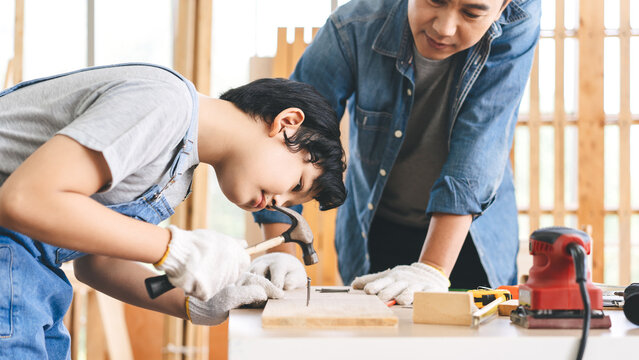 Southeast asian family father and son living together homeschooling