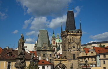 Fototapeta na wymiar Towers of Lesser Town at Charles Bridge in Prague in Czech republic,Europe 