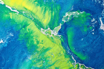 Fototapeta na wymiar Multicolored creative abstract background. Texture of acrylic paint. Stains and blots of alcohol ink green blue yellow colors, fluid art.