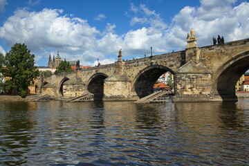Fototapeta na wymiar View of Prague Castle and Charles bridge from the river Vltavain Prague, Czech republic, Europe 