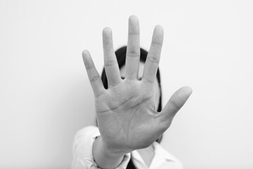 Model of an asian woman using her hand refusing.