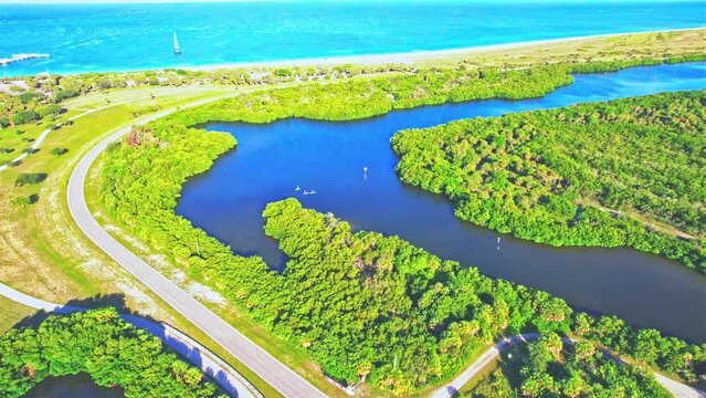 Drone view over the waters and greenery of Fort De Soto Park before the blue skyline