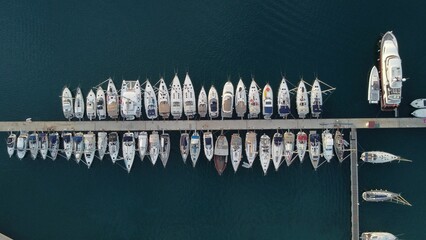 Top view shot of a bunch of boats in a sea