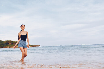 Fototapeta na wymiar lifestyle woman beach happy smile travel running young summer sea sunset