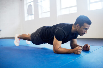 Sports, plank and fitness with man in gym for strong, workout and muscle. Exercise, power and...