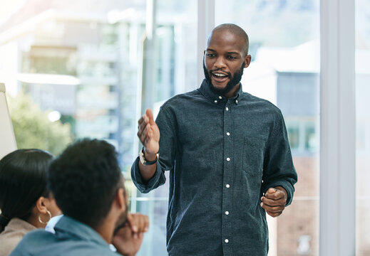 Presentation, Planning And Training With Black Man In Business Meeting For Motivation, Mentor And Leadership. Teamwork, Conference And Speaker With Employee In Workshop For Mission, Project And Idea