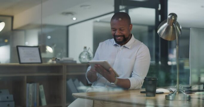 Tablet, scroll and business man in office for online management, website research and happy results at night. Check, search and african person, employee or worker at his desk on digital technology