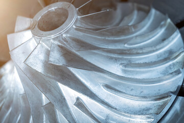 Close up view of metal blades of impeller of centrifugal turbo compressor