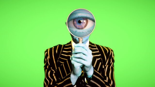 Humanoid Being Eye Magnifying Glass Weird Green Screen Background. Blue humanoid being holding a magnifying glass in front of the eye with a green screen background
