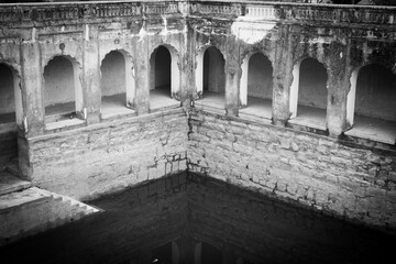 Badi Baoli (step well) for water collection in Qutb Shahi Archaeological Park, Hyderabad, India