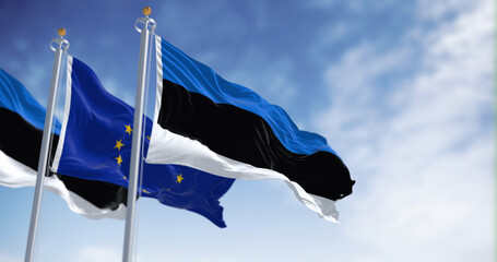The flags of Estonia and the European Union waving together on a clear day