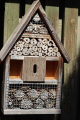 self-built wooden insect hotel in the garden house
