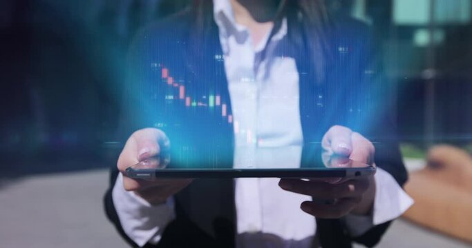 Close up of young businesswoman using digital computer tablet near office building. Bar graph with auto trading computer coding artificial intelligence technology, AI.