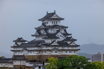 Fototapeta na wymiar Historic Japanese castle in Himeji on grey overcast day