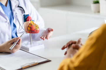 Cardiology Consultation treatment of heart disease. Doctor cardiologist while consultation showing...