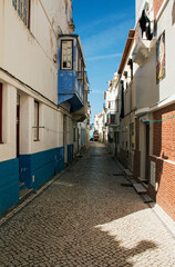 Fototapeta na wymiar Typical street in the fishing village of Nazaré, Portugal