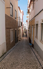 Fototapeta na wymiar Typical street in the fishing village of Nazaré, Portugal